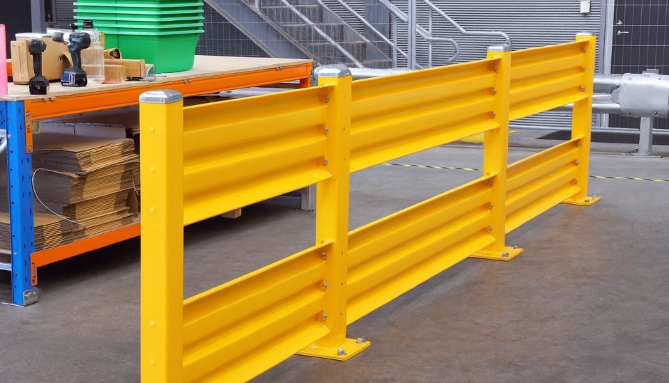 close up warehouse safety guard rail fencing barrier yellow