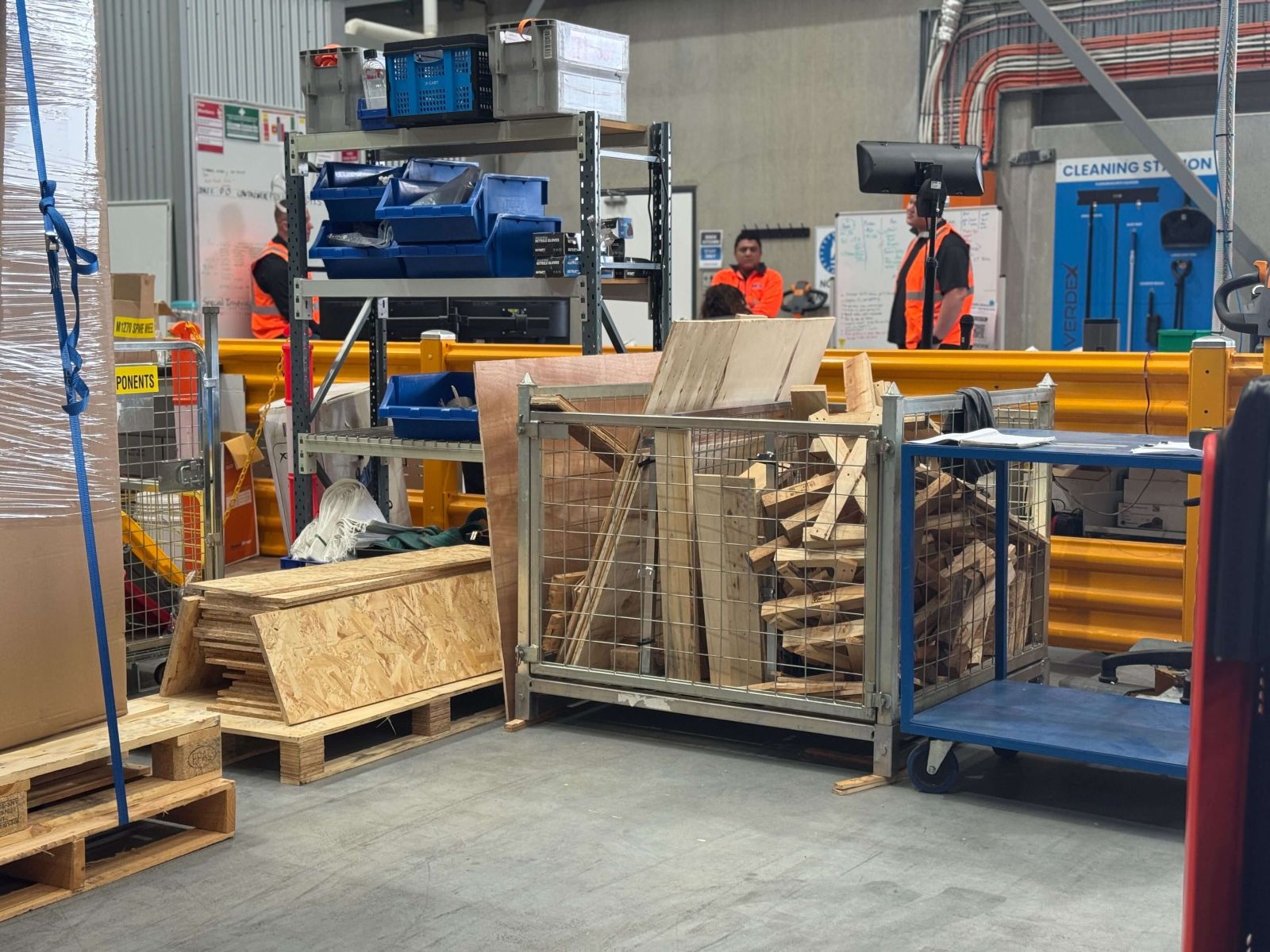 Crane Pallet Cage transporting timber in a workshop.