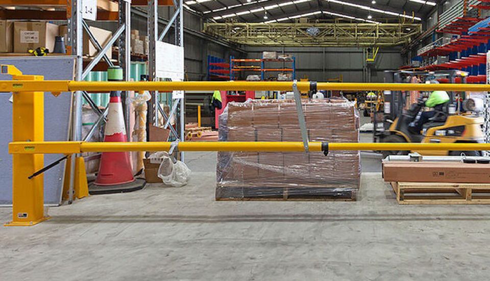 double yellow telescopic boom gate rail warehouse