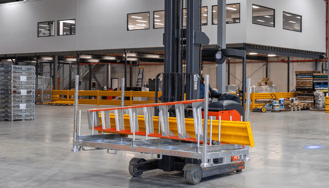 Extra Large 4 Post Stillage used in a warehouse with ladders and forklift.