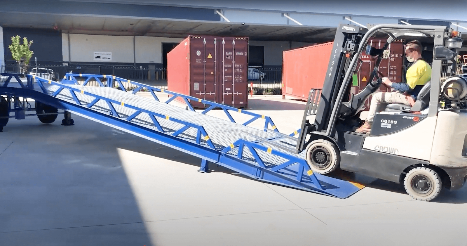 Forklift Driver Demonstrating Verdex Mobile Loading Dock Container Ramp