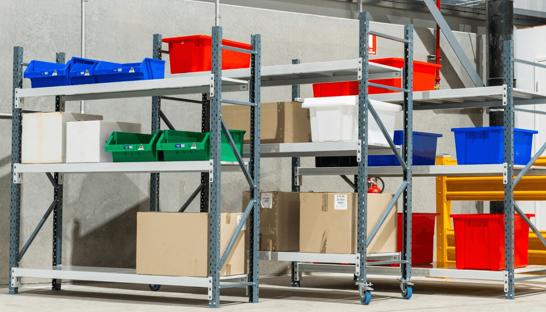 Heavy duty steel longspan shelving in a warehouse with various bay sizes.