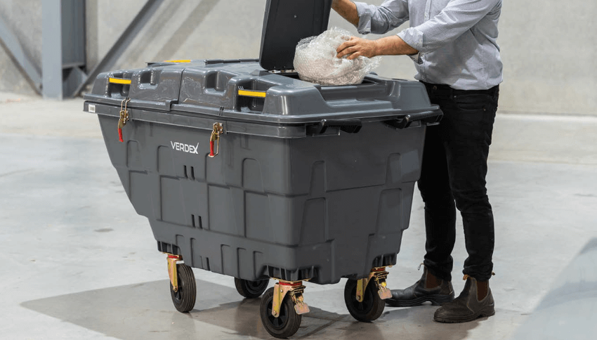 Placing Rubbish Into Large 500L Mobile Waste Bin