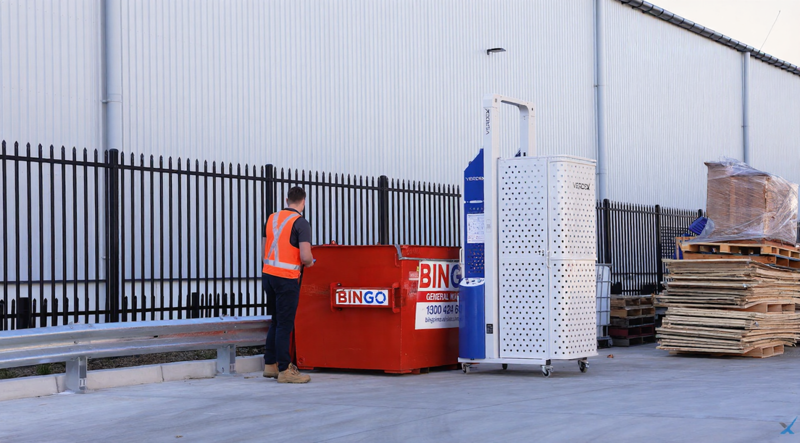 Warehouse Manager Activating Verdex Auto Wheelie Bin Tipper With Remote Outside