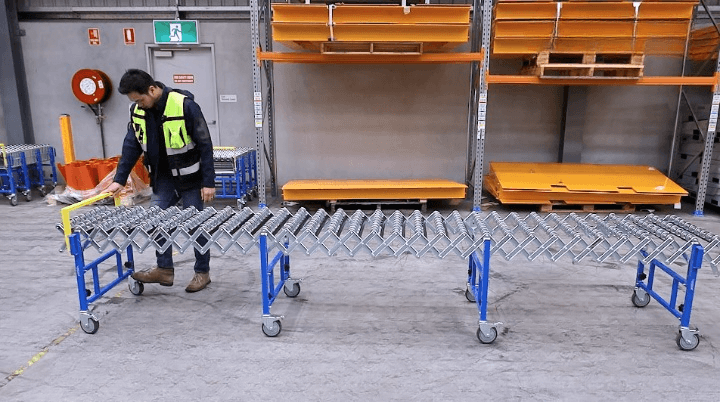 Warehouse Manager Viewing Flexible Expanding Skate Conveyor