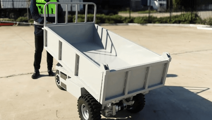 Warehouse Retail Specialist Using Powered Dump Truck Trolley_Cleanup%20(1)