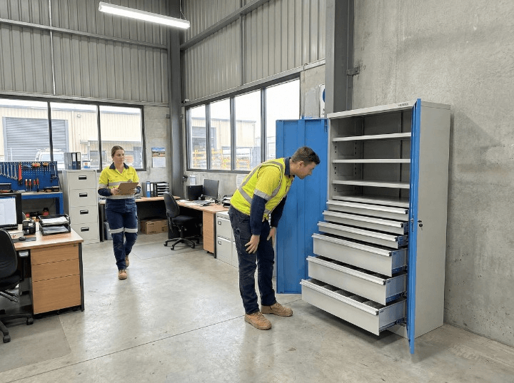 Workers Inspecting Heavy Duty Cabinets Complete With Drawers Warehouse Office_Cleanup
