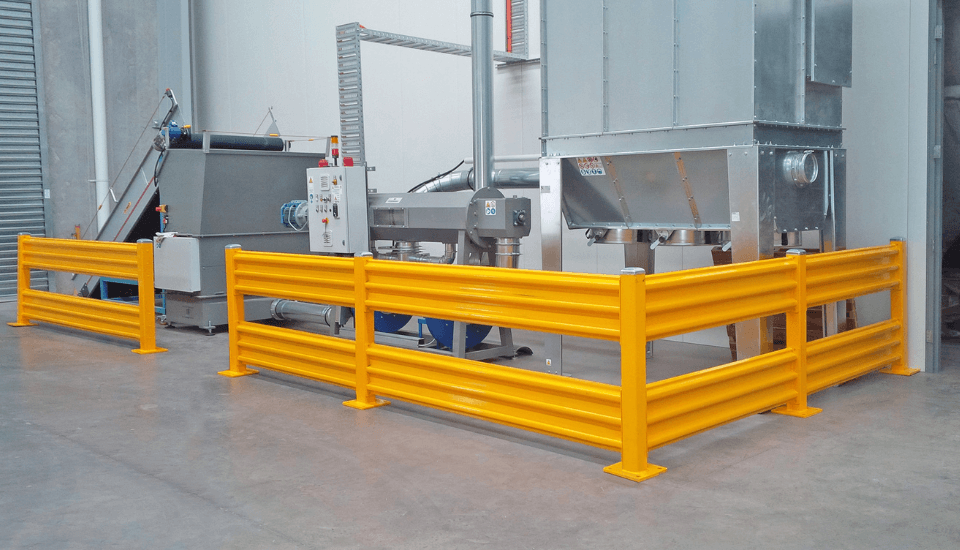 yellow safety guard rail fencing set up in warehouse setting