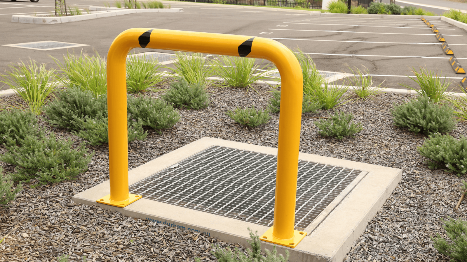 yellow u bar high bollard storm drain outdoor carpark