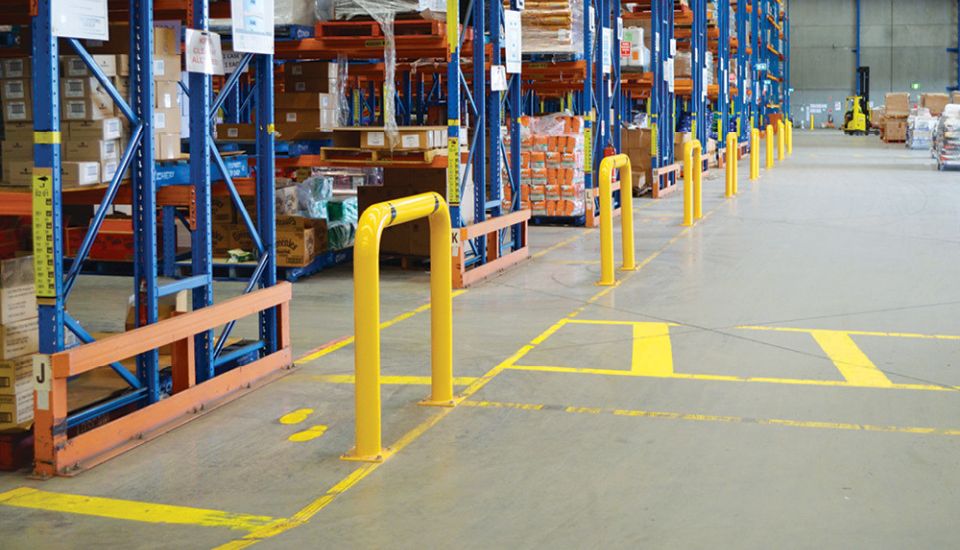 yellow u bar high bollards used on warehouse floor